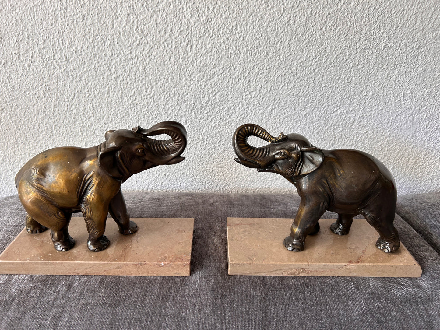 French Art Deco Bronze Elephant Bookends — Matched Pair, Trunks Raised, on Travertine Bases
