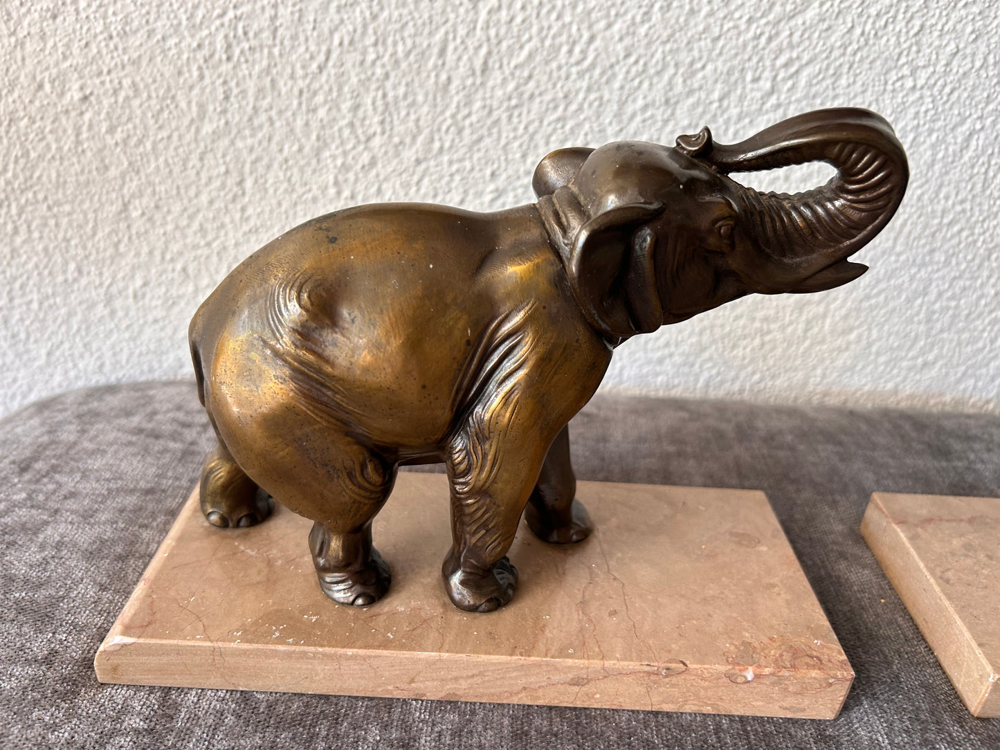 French Art Deco Bronze Elephant Bookends — Matched Pair, Trunks Raised, on Travertine Bases