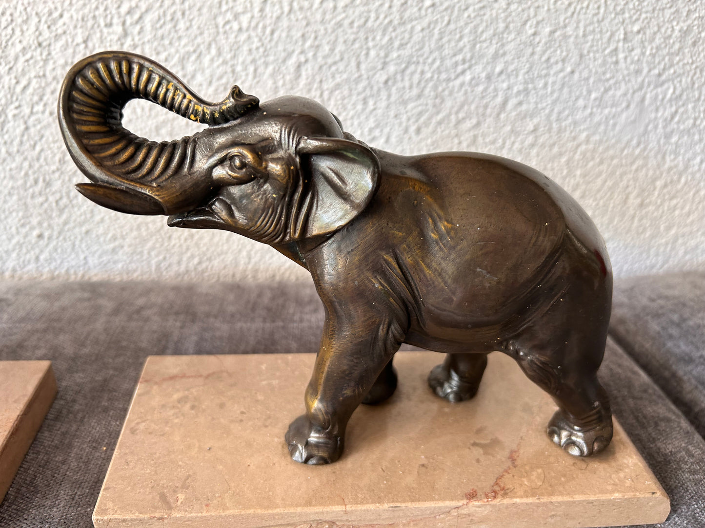 French Art Deco Bronze Elephant Bookends — Matched Pair, Trunks Raised, on Travertine Bases