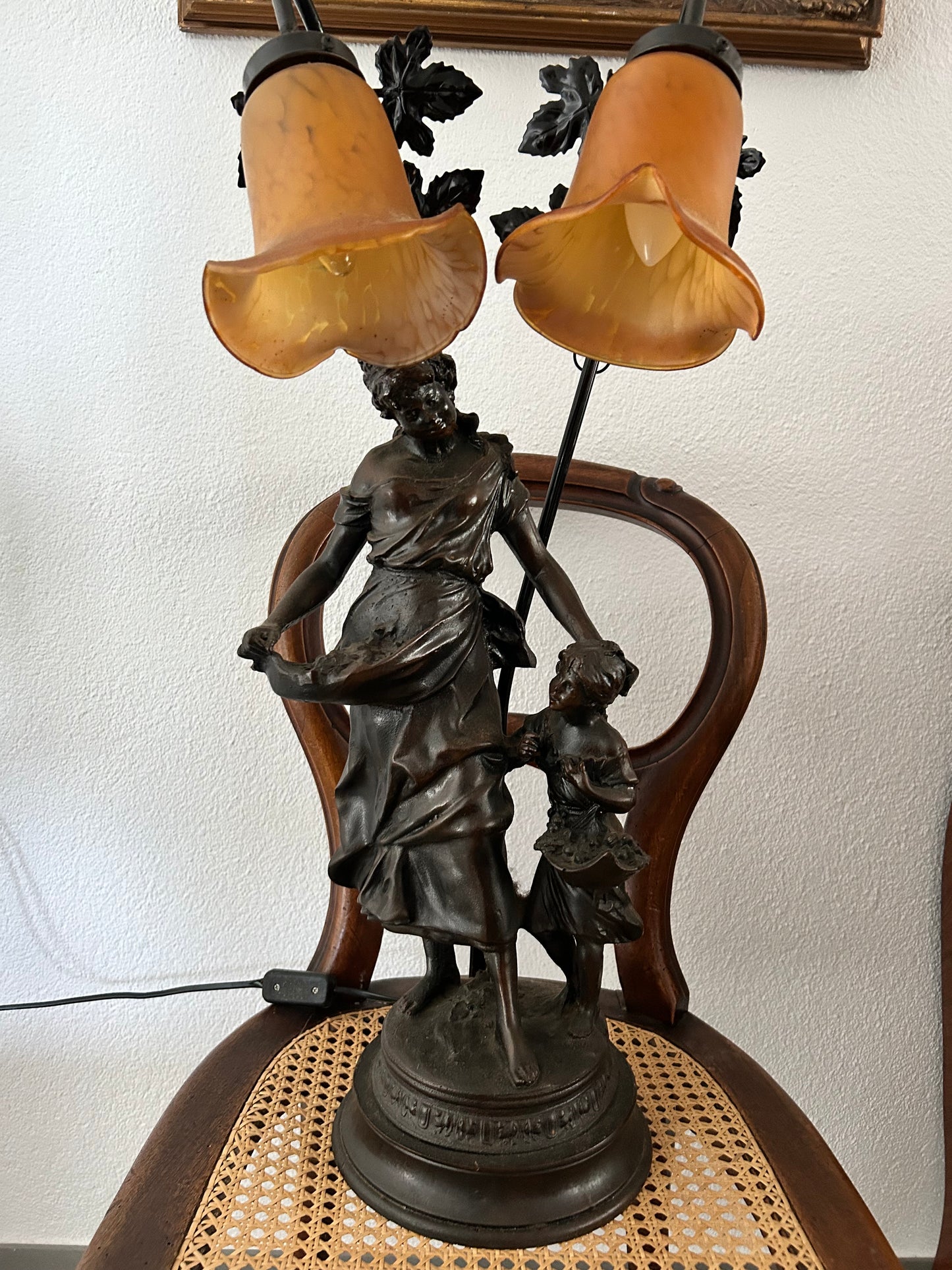 Art Nouveau figural double lamp with woman and child, dark patinated spelter base