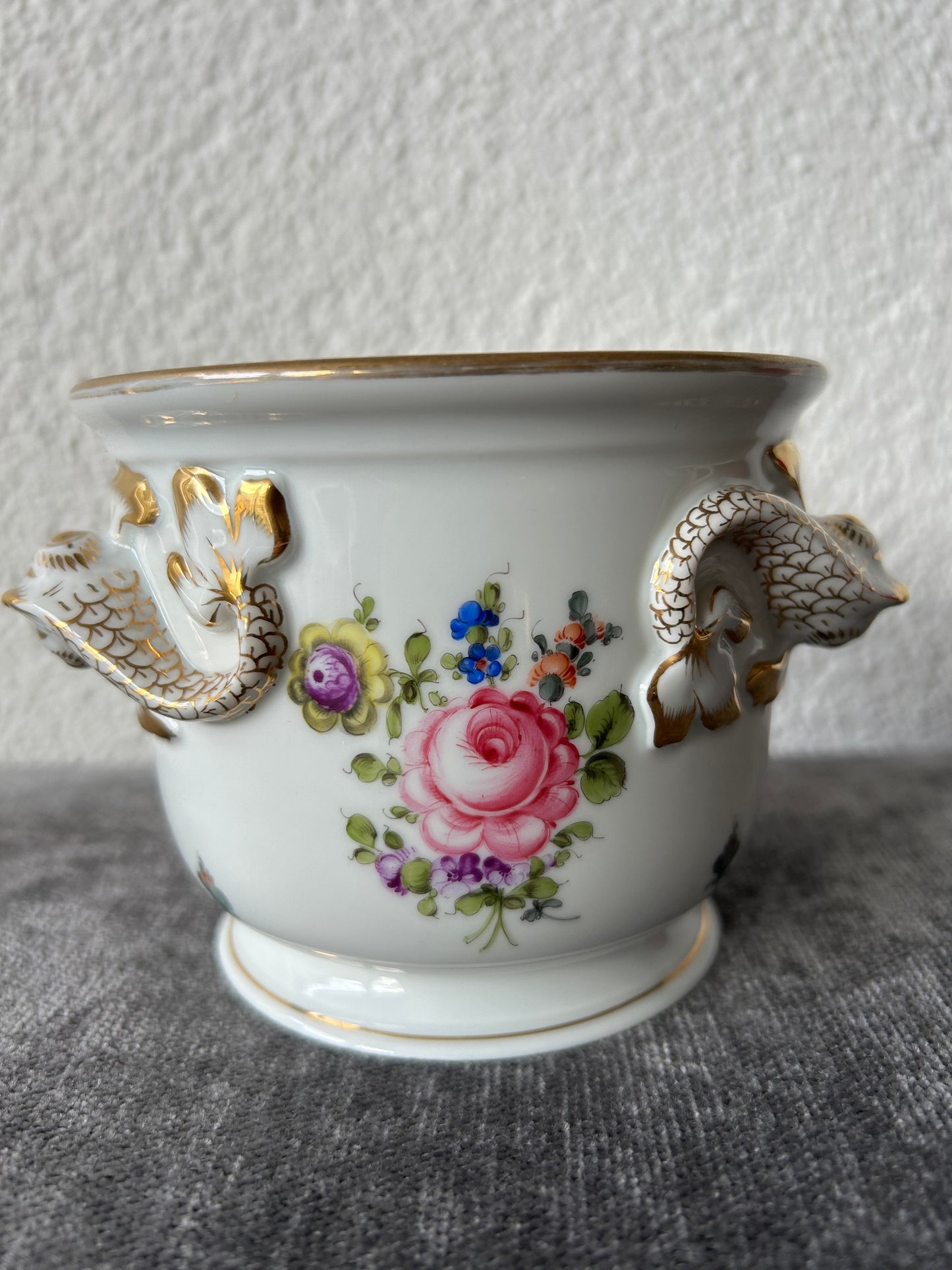 Porcelain cachepot with dolphin head handles and floral decoration by Herend