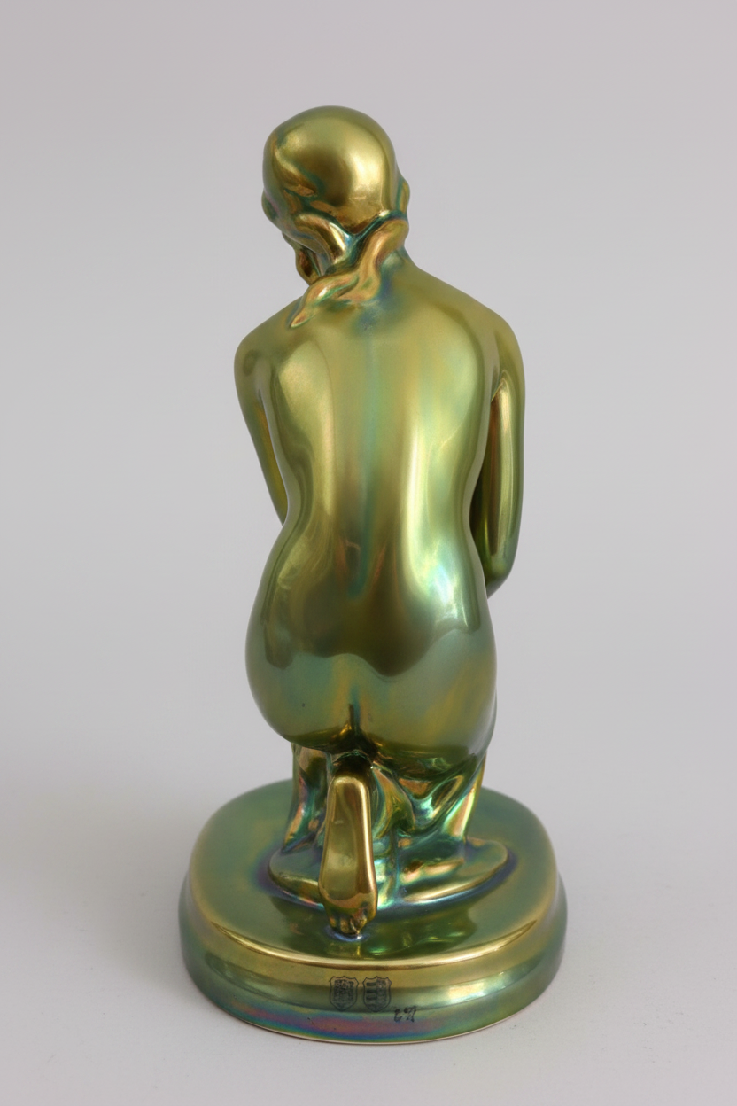 Zsolnay eosin seated female nude — rear view, neutral grey background